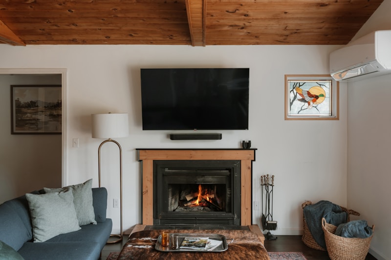Modern gas fireplace with floor-to-ceiling stone surround in Ashburn home