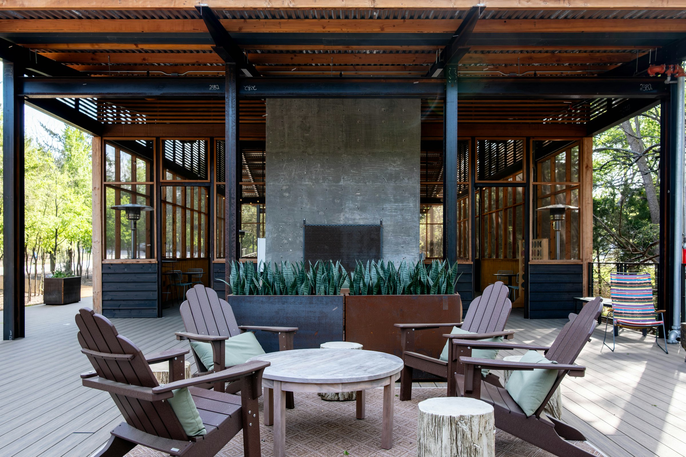 Covered outdoor living space with a modern fireplace in a Northern Virginia backyard